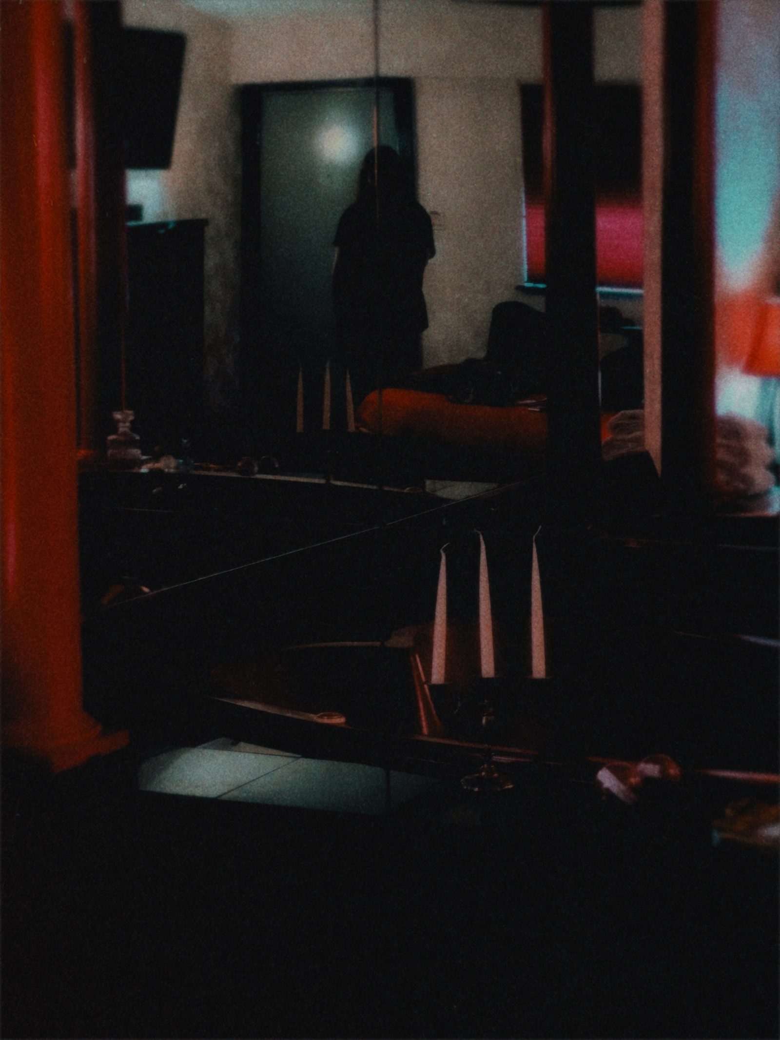 Candlelit self-portrait of durl reflected in a mirror